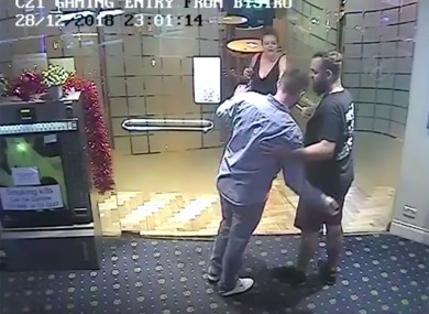 A screengrab of CCTV images of Christopher McLaughlin (blue shirt) leaving the Summer Hill Hotel on December 28, 2018, in the company of neighbour Lucy Lovett and her partner.