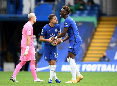 Chelsea's Cesar Azpilicueta (centre) argues with Tammy Abraham over who should take the second penalty.