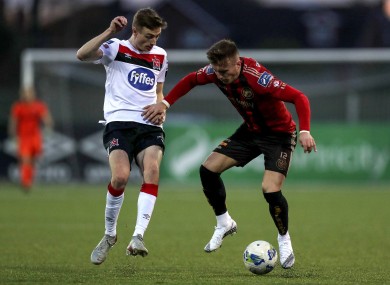 Daniels Kelly and Grant battle for possession at Oriel Park.