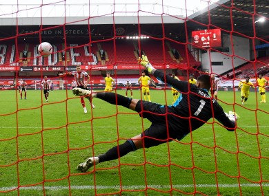Sharp hammers home his late penalty.