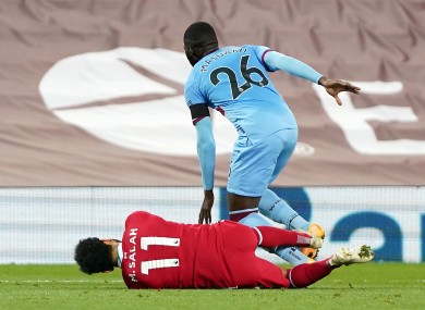 Liverpool's Mohamed Salah (left) is fouled by West Ham United's Arthur Masuaku.