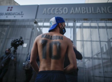 Football fans outside Clinica Olivos where Diego Maradona underwent surgery.