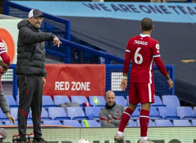 Liverpool's manager Jurgen Klopp issues instructions to Thiago Alcantara at Goodison Park.