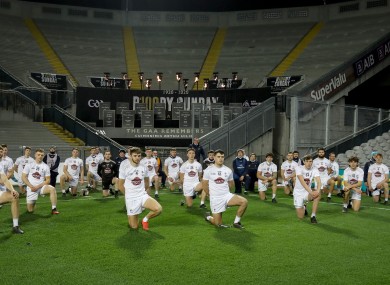 The Kildare hurlers paying their respects at Croke Park's Bloody Sunday memorial after the win against Down.