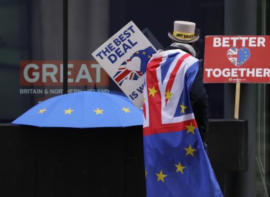 A pro-EU demonstrator holding banners outside the conference centre in Westminster last week.
