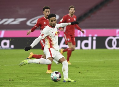 Justin Kluivert strikes to put Leipzig ahead.