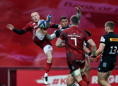 Keith Earls competes for a high ball against Harlequins.