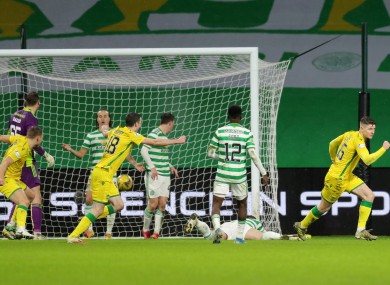 Hibernian's Kevin Nisbet celebrates a late equaliser at Celtic Park.
