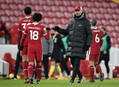 Liverpool manager Jurgen Klopp consoles Takumi Minamino after Thursday night's defeat to Burnley.
