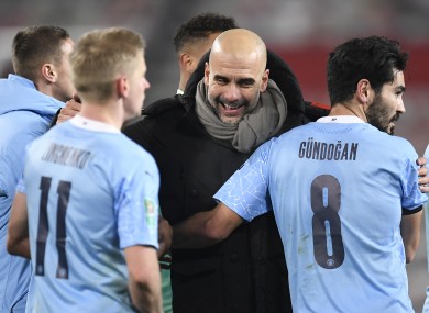 Pep Guardiola celebrates with his players after the win over Man Utd.