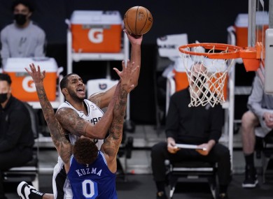 San Antonio Spurs forward LaMarcus Aldridge (12) takes a shot against Los Angeles Lakers forward Kyle Kuzma.