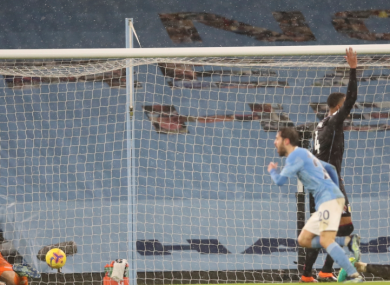 Bernardo Sllva celebrates as Villa players appeal for offside.