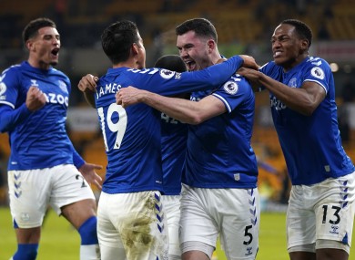 Everton players celebrate Michael Keane's goal against Wolves.