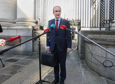The Taoiseach on his way into government buildings yesterday.