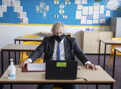 Johnson takes part in an online class during a visit to Sedgehill School in Lewisham, south east London yesterday.
