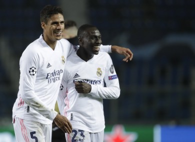 Ferland Mendy, right, celebrates with Raphael Varane.