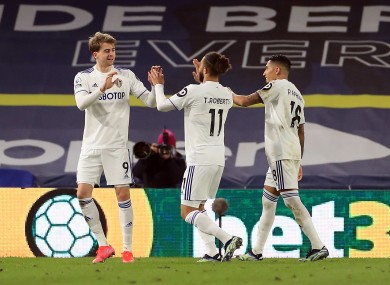 Leeds United's Patrick Bamford celebrates scoring their side's first goal of the game with team-mates.