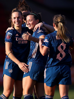 Katie McCabe celebrating with her team-mates.