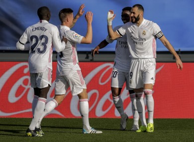 Players celebrate after Karim Benzema scores for Real Madrid.
