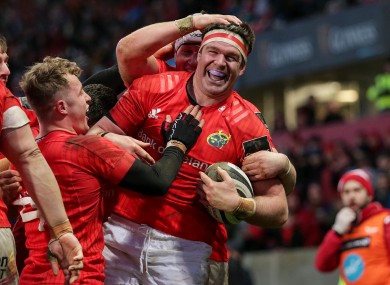 Billy Holland celebrates a try for Munster.