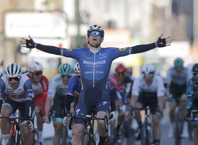 Sam Bennett celebrates as he crosses the finish line to win the first stage of the Paris Nice cycling race.