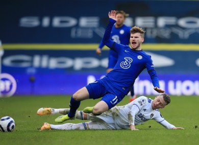 Chelsea's Timo Werner is tackled by Leeds United's Ezgjan Alioski.