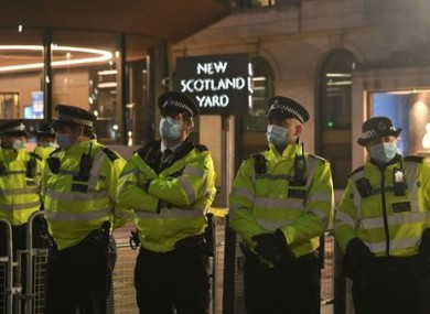 Police officers outside New Scotland Yard in London.