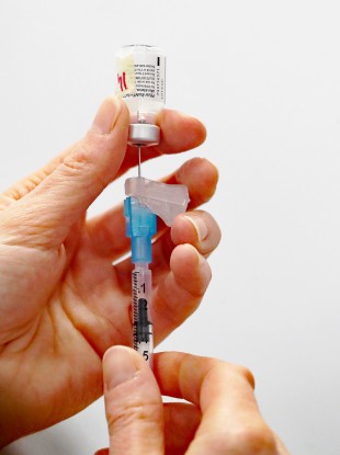 A dose of the Pfizer-BioNTech Covid-19 vaccine is prepared at Waterford Primary Care Centre.