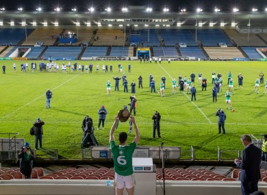 Declan Hannon raises the Munster senior hurling cup.