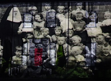 A picture from a mother and baby home is projected onto Sean Ross Abbey in Tipperary as part of the Herstory Light Show to mark St Brigid's Day in February.