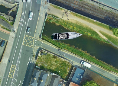 An aerial image showing the statue of Kelly in the beleaguered barge.