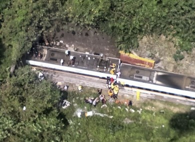 Rescue workers are seen near the site of a partial train derailment in Toroko Gorge in Taiwan’s east