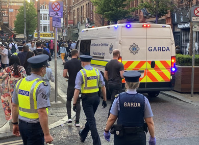 embers of Gardai enforce coronavirus restrictions and move people on from South William St, Dublin