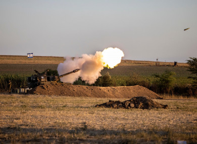 An Israeli artillery unit fires shells towards targets in the Gaza Strip