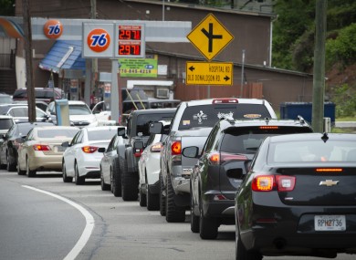 Motorists queue along a highway in North Georgia, hoping to fuel their cars and trucks at a gas station before supplies run dry