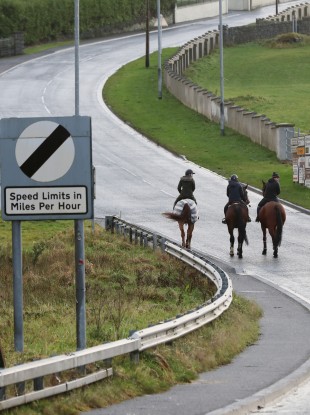 A group of horse riders cross the border from Ireland into Northern Ireland at Carrickcarnan, Co Louth.