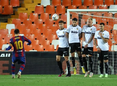 Lionel Messi scores Barcelona's third goal against Valencia