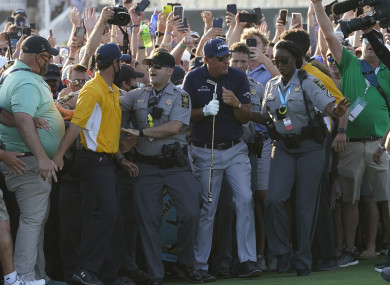 Phil Mickelson tries to move through the crowd on the 18th hole at Kiawah Island.