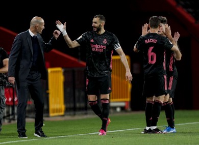Real Madrid's Karim Benzema, centre,celebrates with his coach Zinedine Zidane.