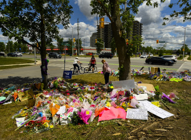 A women visits the scene and a tribute to the victims of the deadly vehicle attack on five members of the Canadian Muslim community in London, Ontario