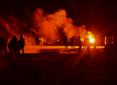 Police repeatedly fired tear gas and charged clusters of partygoers who hurled projectiles at security forces.