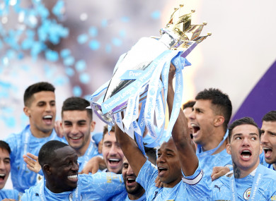 Manchester City celebrate with the trophy.