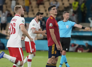Spain's Gerard Morena, centre right, reacts after missing a penalty.