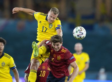 Sweden's Viktor Claesson, left, challenges with Spain's Pau Torres during the Group E match.