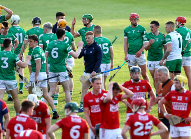Both teams after the game at the Gaelic Grounds.