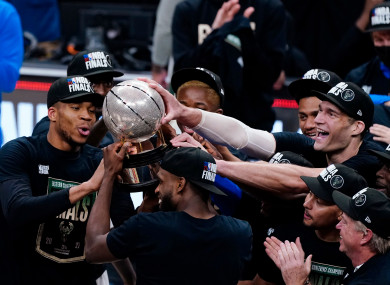 The Milwaukee Bucks hoist the trophy after defeating the Atlanta Hawks in game six of the Eastern Conference finals.