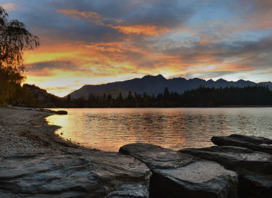 The sun over lake Wakatipu in Queenstown, New Zealand