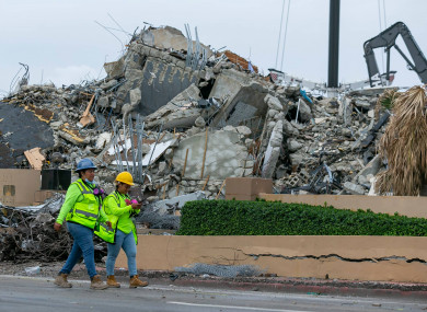 Workers at the Champlain Towers South site (Miami Herald via AP)