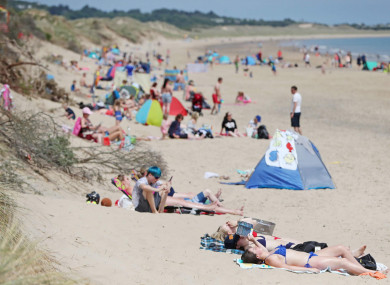 Family groups on the beach at Brittas Bay, Co Wicklow.