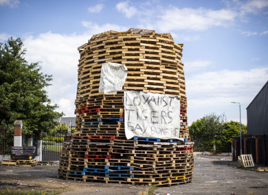A controversial loyalist bonfire built at the interface in north Belfast dividing loyalist Tigers Bay and nationalist New Lodge (Liam McBurney/PA)
